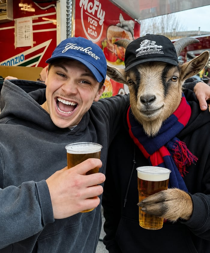 Matt Blackhall having a pint with a goat at a food truck